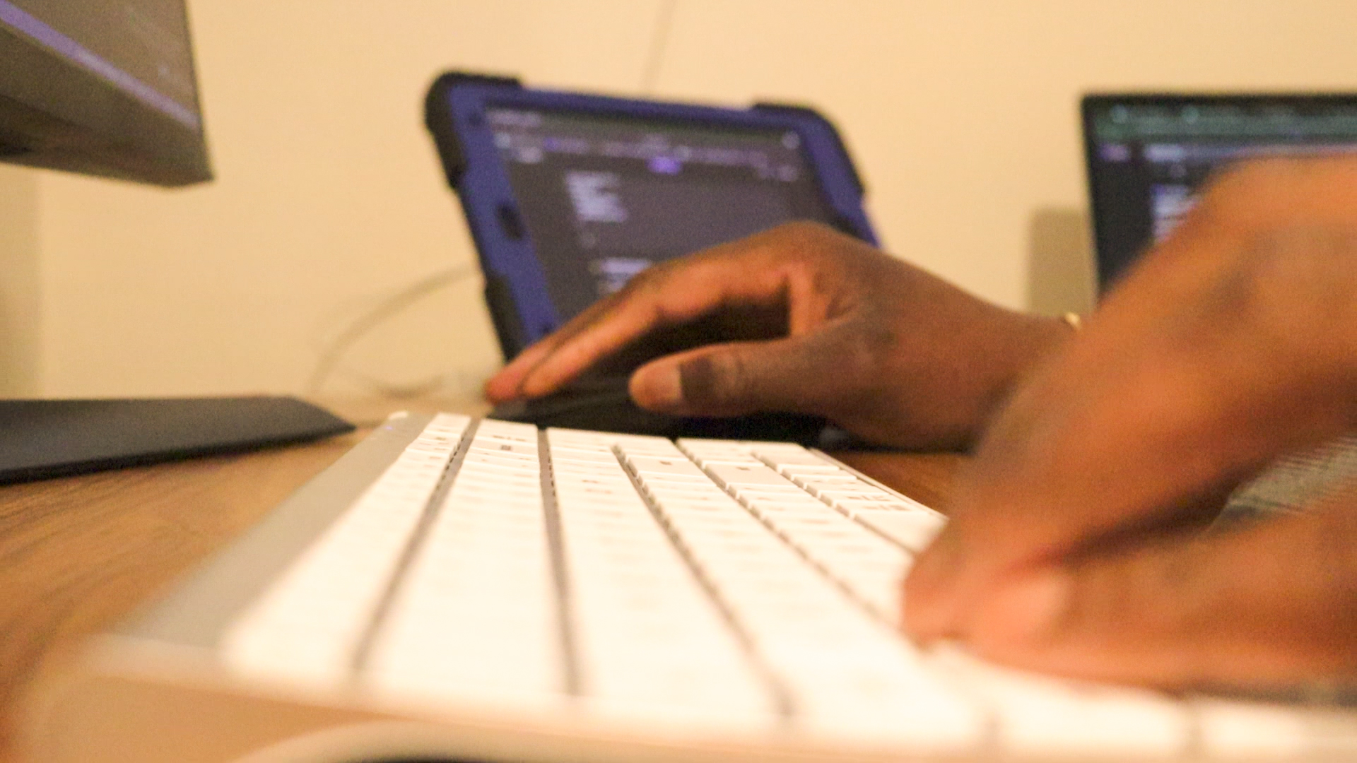 Toyin Ikuomenisan, co-founder of Ikuo Studio, designing a custom website